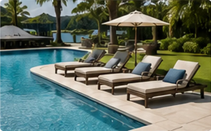 Pool loungers arranged beside a swimming pool